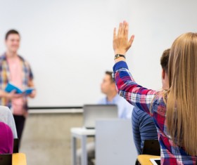 Raise questions in the classroom Girls Stock Photo