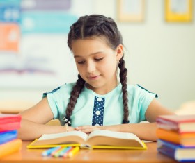 Reading the little girl Stock Photo
