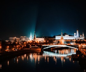 Reflection of bright sparkling cityscape on lake Stock Photo