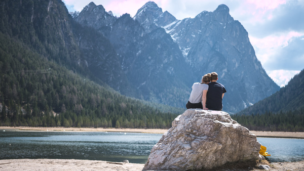Romantic couple relaxing on mountain river scene Stock Photo