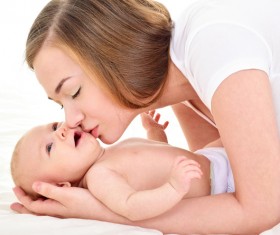 Smiling mother holding the baby Stock Photo 03