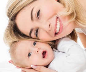 Smiling mother holding the baby Stock Photo 05