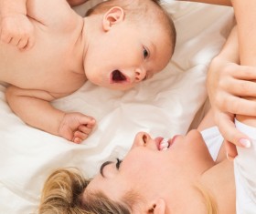 Smiling mother holding the baby Stock Photo 06