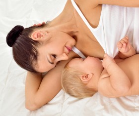 Smiling mother holding the baby Stock Photo 07