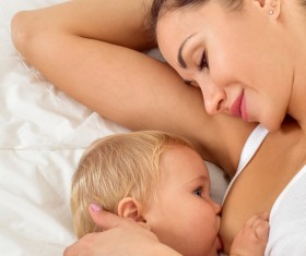 Smiling mother holding the baby Stock Photo 13