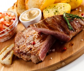 Steak and salad ingredients on a cutting board Stock Photo