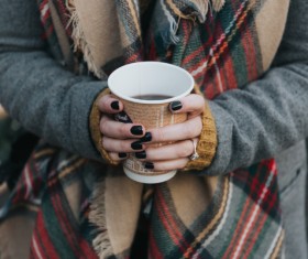 Stylish woman holding coffee cup in hands Stock Photo