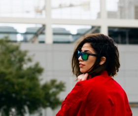 Stylish young woman with sunglasses and red shirt Stock Photo
