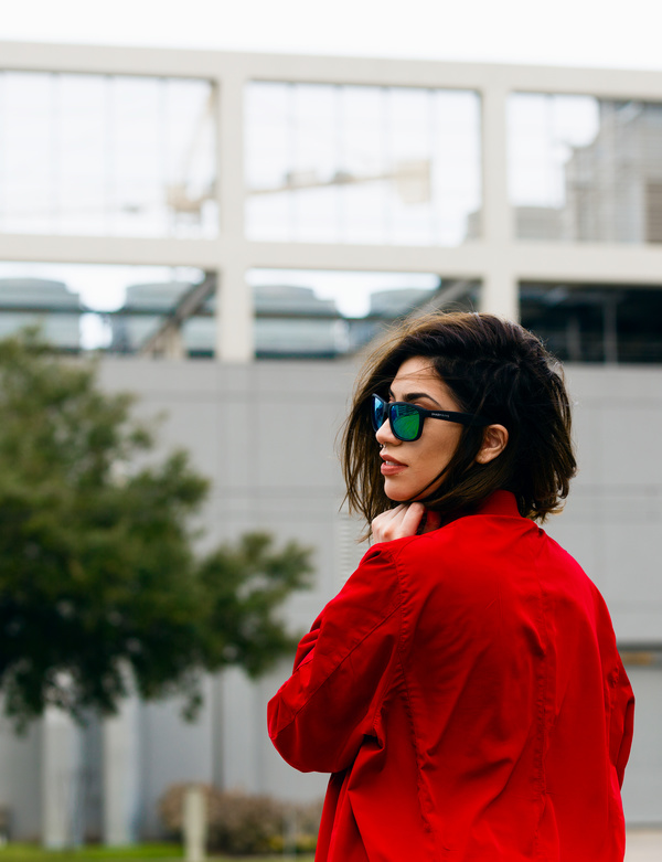 Stylish young woman with sunglasses and red shirt Stock Photo