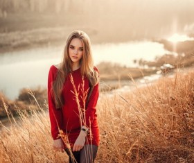 The beautiful girl in the weeds Stock Photo