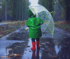 The little girl with an umbrella on rainy day Stock Photo 03