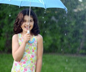 The little girl with an umbrella on rainy day Stock Photo 07