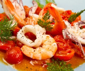Tomatoes fried seafood Stock Photo
