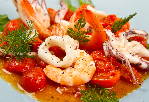 Tomatoes fried seafood Stock Photo