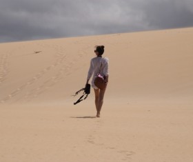 Walking girls in the desert Stock Photo