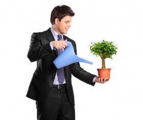 Water the plant young man Stock Photo
