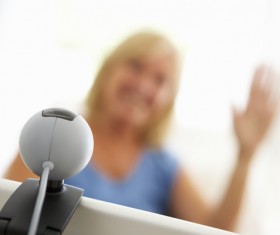 Webcam conversation via computer technology Stock Photo 04