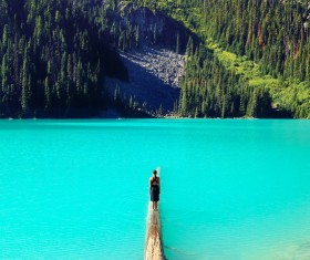 Woman in front of beautiful mountain seascape Stock Photo