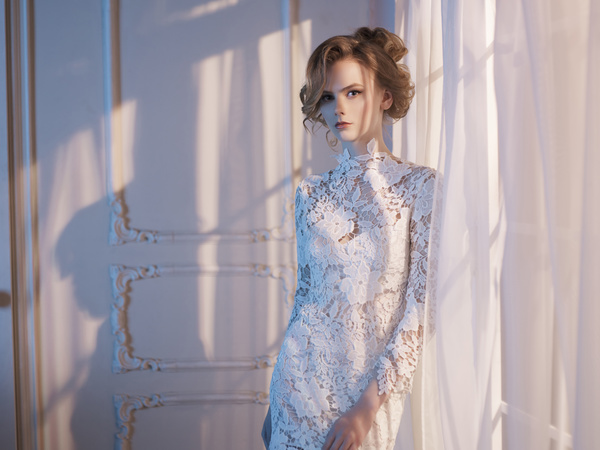 Woman in lace dress at the window Stock Photo 03