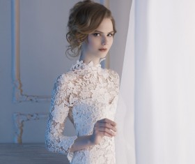 Woman in lace dress at the window Stock Photo 04