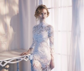 Woman in lace dress at the window Stock Photo 06