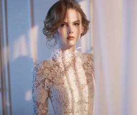 Woman in lace dress at the window Stock Photo 07