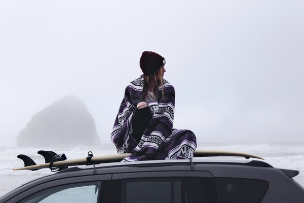 Woman sitting on car dome with traditional cloth Stock Photo