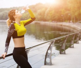 girl who drinks water after exercising Stock Photo 01