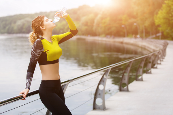 girl who drinks water after exercising Stock Photo 01