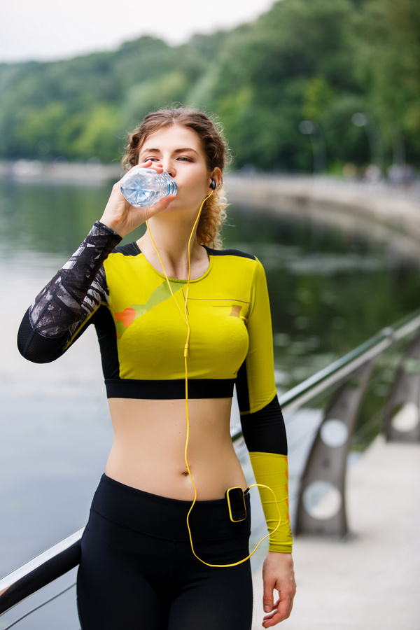girl who drinks water after exercising Stock Photo 02