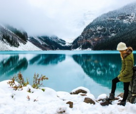 A woman enjoying the beauty of winter lake Stock Photo