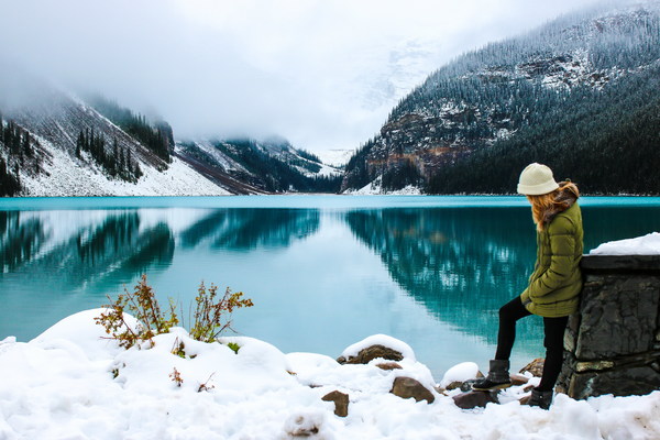 A woman enjoying the beauty of winter lake Stock Photo