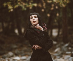 Beautiful woman posing with warm clothes Stock Photo