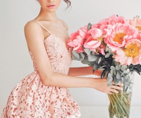 Beautiful young woman with bouquet of peony Stock Photo 01