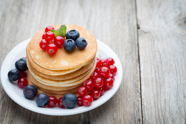 Blueberry cherry pancakes decorated Stock Photo