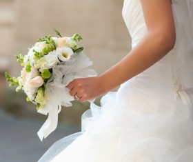 Bride holding bouquet of flowers Stock Photo