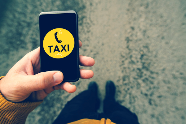 Call Taxi on your mobile phone Stock Photo 01
