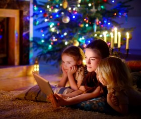 Christmas mother and daughter watching the video together Stock Photo
