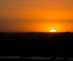 Dark sunset on mountain range Stock Photo