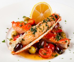Delicious crab legs with lemon olives Stock Photo