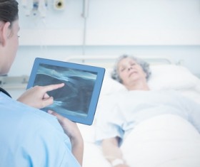 Doctor working with tablet in hands Stock Photo 01
