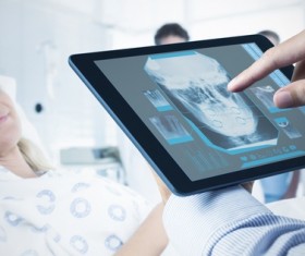 Doctor working with tablet in hands Stock Photo 04