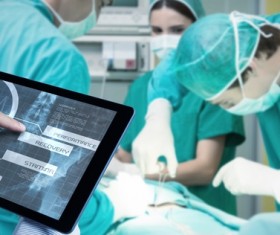 Doctor working with tablet in hands Stock Photo 05