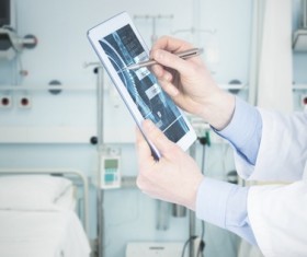 Doctor working with tablet in hands Stock Photo 06