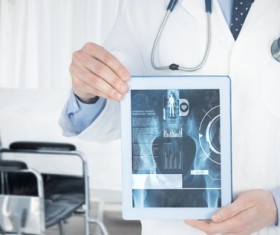Doctor working with tablet in hands Stock Photo 07