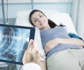 Doctor working with tablet in hands Stock Photo 09