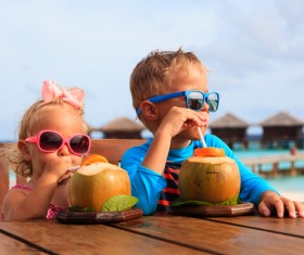 Drink coconut juice brother and sister Stock Photo