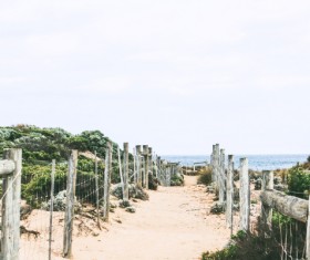 Empty sandy pathway to sea Stock Photo