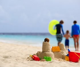 Family playing on the beach Stock Photo
