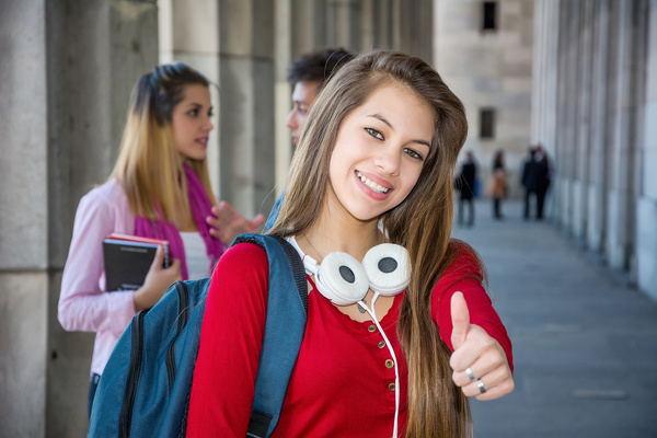 Female college student thumbs up Stock Photo